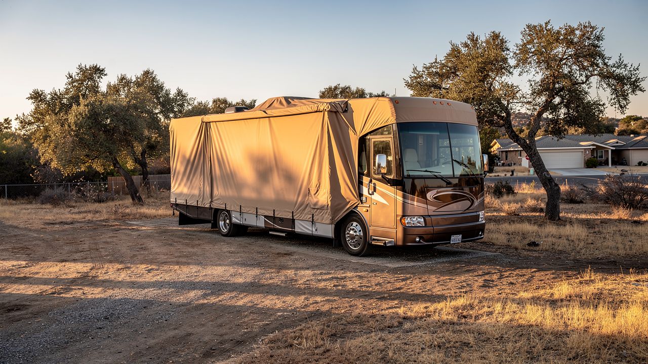 Class A motorhome covered for winter storage in Southern California